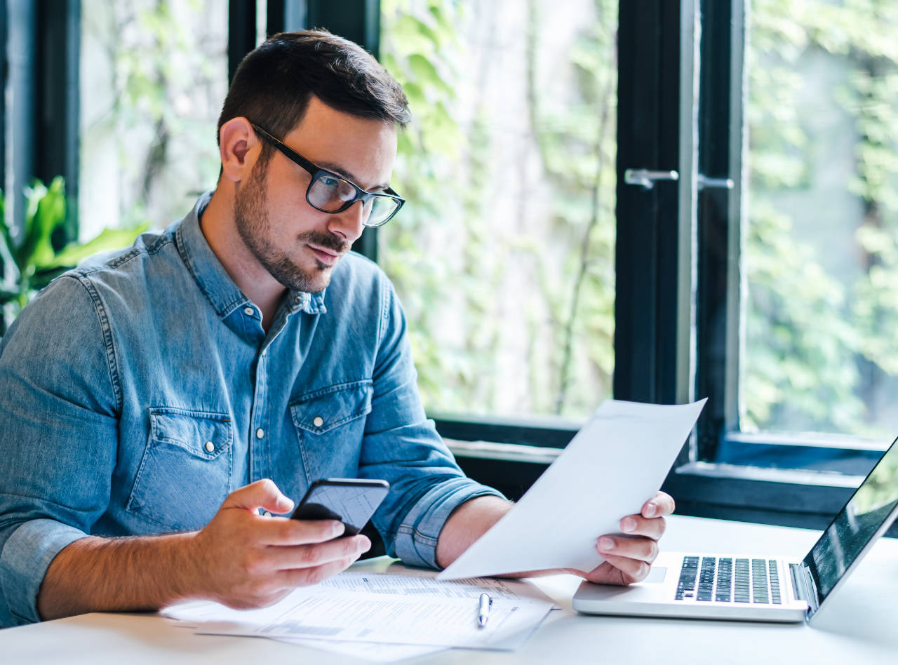 Young accountant working on payroll